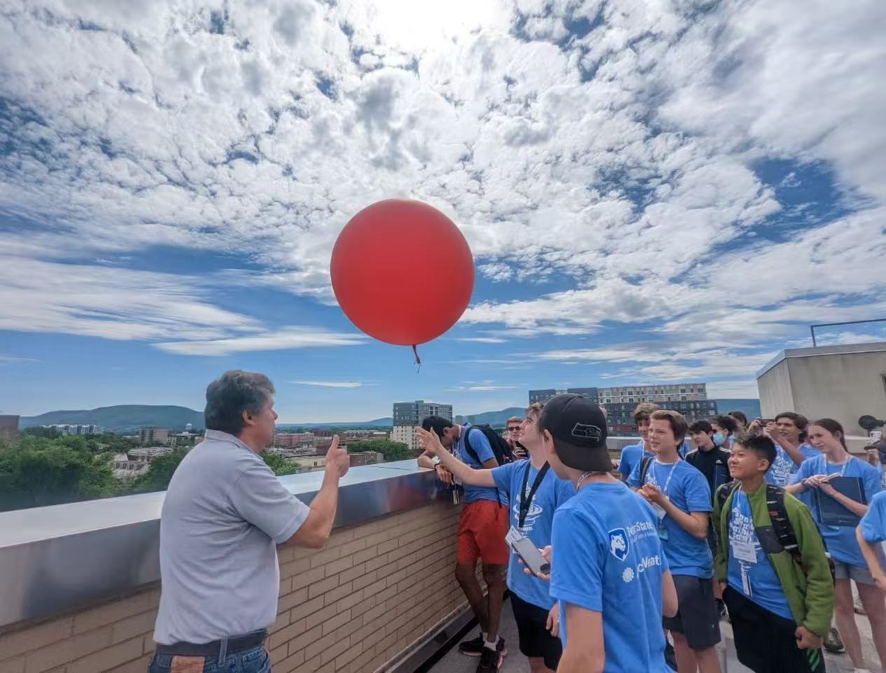 Weather camp participants launching a balloon at Penn State